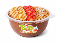 Smoothie bowl with banana, strawberry, granola, and caramel